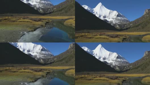4 k倾斜;中国亚丁自然保护区雪山上的河流。高清在线视频素材下载