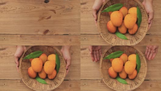 有机芒果热带水果篮子放在木制的背景高清在线视频素材下载