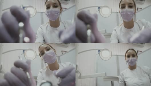牙科医生在口腔诊所用角探针检查病人的牙齿高清在线视频素材下载