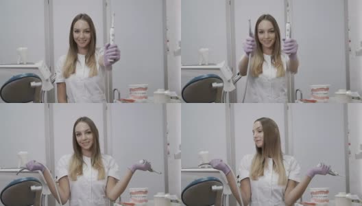 美丽的牙医在镜头上展示钻机和电动牙刷高清在线视频素材下载