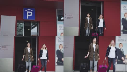 两个女人从停车场走到机场高清在线视频素材下载