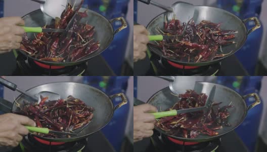 用平底锅煮干红辣椒，泰国菜高清在线视频素材下载