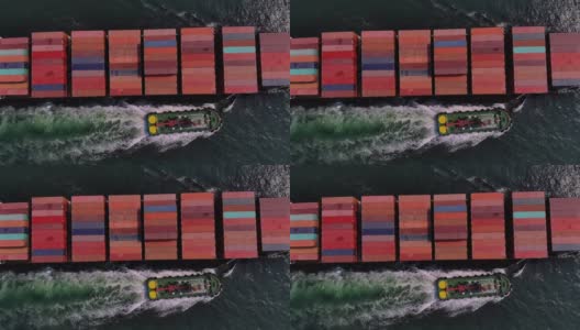 4k集装箱货轮及运输，商业国际贸易和集装箱物流进出口港到国际港口/货轮通过港-无人机俯视图高清在线视频素材下载