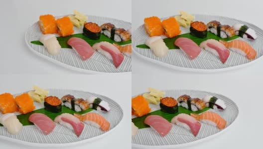各种日本手握寿司传统食物的白色盘子高清在线视频素材下载