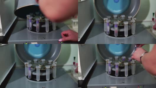 实验室工作人员正在把试管插入生化分析仪高清在线视频素材下载