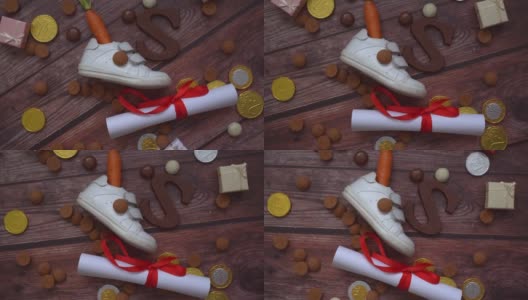 荷兰节日圣诞的背景。轮换儿童鞋，胡萝卜为圣诞老人的马，礼物，传统的糖果胡椒和巧克力信。Schoentje zetten概念。4 k的视频高清在线视频素材下载