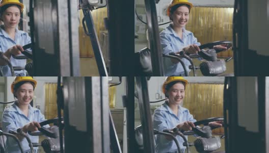 幸福微笑的亚洲女女工在安全帽驾驶叉车在仓库工厂高清在线视频素材下载