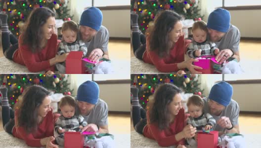 慈爱的父母庆祝宝宝的第一个圣诞节高清在线视频素材下载