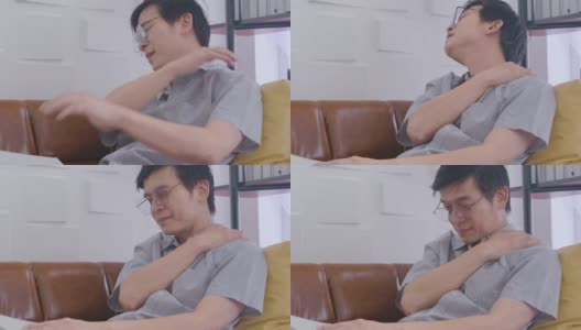 亚洲男人坐着看书累了脖子和背疼高清在线视频素材下载