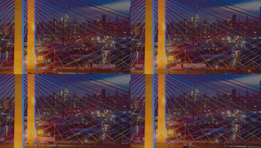 在灯火通明的科修斯科大桥上，曼哈顿中城天际线的夜景。静态摄像机的航拍视频。高清在线视频素材下载