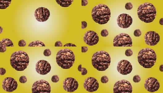 在4K超高清镜头中，不同直径的Flying Cookies早餐在趋势黄色渐变背景(水平，不可循环)上移动到中心高清在线视频素材下载