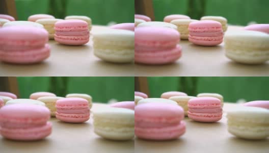 婚礼上粉色和黄色蛋白杏仁饼干的特写镜头。高清在线视频素材下载