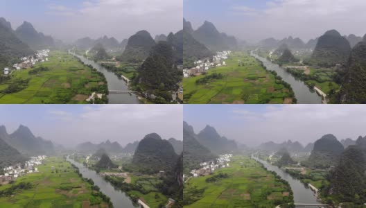 中国南方一条河谷中的河流。被喀斯特山脉环绕(鸟瞰图)高清在线视频素材下载