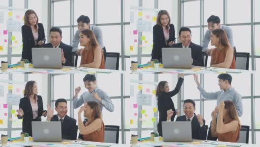 商业上的成功，集团亚洲创意商业团队手臂举起，为一个新的好，青年亚洲团队庆祝获胜项目在会议室办公室，快乐，积极满足的情绪高清在线视频素材下载