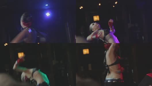 美丽的东方传统肚皮舞者随着音乐舞动在舞台上，表演高清在线视频素材下载