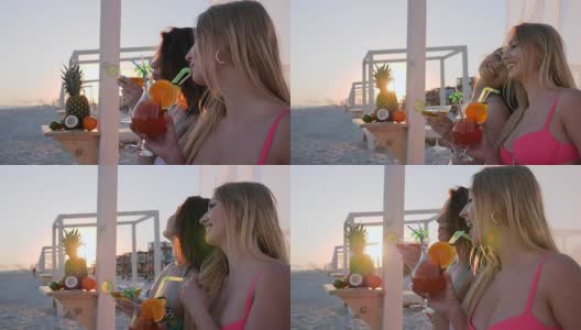 在海滩上陪伴女友，夏天在海滩上休息派对，微笑的女孩在海边喝酒，姐妹们在海边聊天高清在线视频素材下载