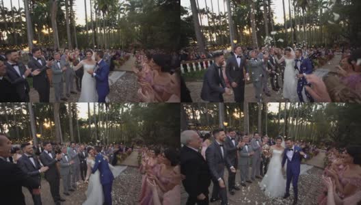 快乐的新婚夫妇身上撒着五彩纸屑高清在线视频素材下载