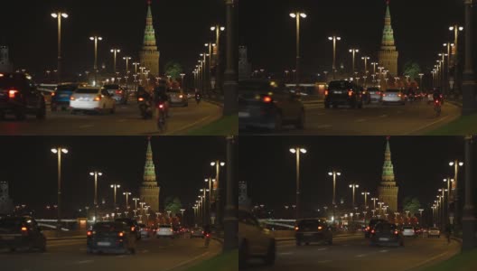 莫斯科,俄罗斯。2019年8月10日。夜景，克里姆林宫的城墙，汽车沿着克里姆林宫的街道走到河堤上高清在线视频素材下载