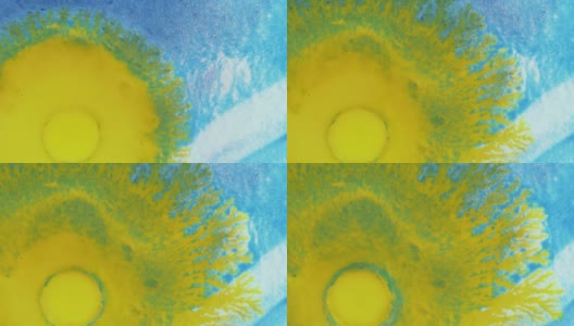 水晶发芽。蓝色背景上的抽象黄色斑点。抽象的垃圾艺术，墨水颜料扩散爆炸的背景。高清在线视频素材下载