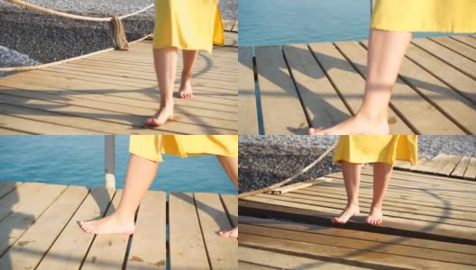 一个女人光着脚走在海上的旧木码头上高清在线视频素材下载