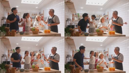 4K多代亚洲家庭在厨房一起跳舞。高清在线视频素材下载