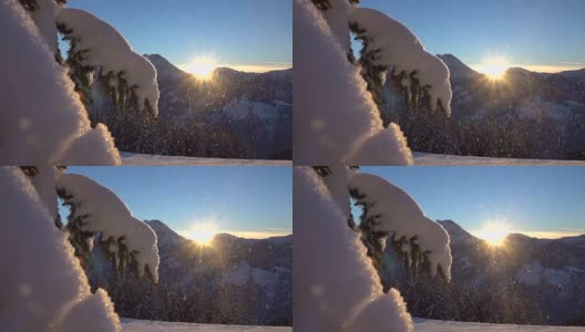 慢镜头:在神奇的日落时分，雪花飘落在洁白的雪毯上高清在线视频素材下载