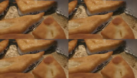 Pirozhki made of dough in frying pan特写3840X2160超高清镜头-美味油炸馒头流行小吃4K 2160p 30fps超高清视频高清在线视频素材下载
