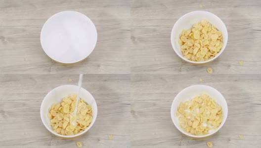 准备早餐的麦片和牛奶放在一个碗里放在木桌上。前视图。高清在线视频素材下载