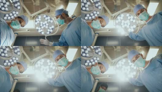 外科医生在手术中设置手术灯高清在线视频素材下载