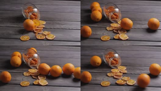 木背景上放着干鲜橙子。高清在线视频素材下载