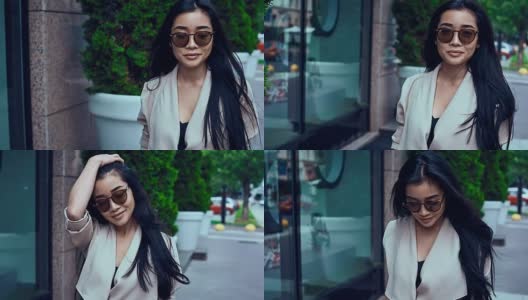 可爱和华丽的亚洲女人在时尚外套在街上高清在线视频素材下载