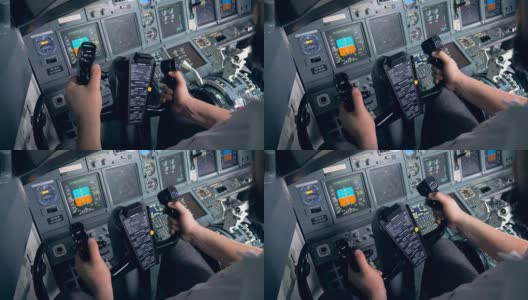 一名飞行员正在操纵飞机座舱里的方向盘高清在线视频素材下载