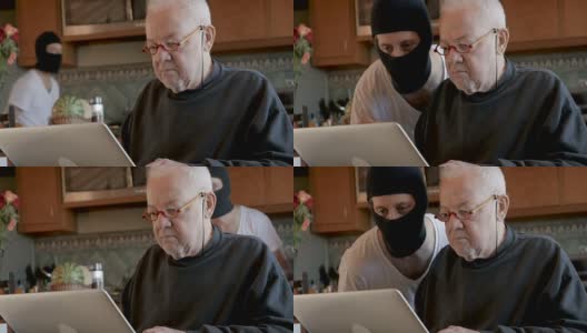 小偷潜伏在老人家里窃取他的隐私数据或在线资产高清在线视频素材下载