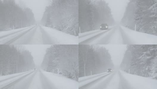 冬季驾驶-在一个大雾天大雪在一个下雪的乡村道路上驾驶-手持拍摄，稳定高清在线视频素材下载