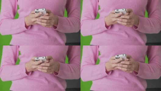 女人用手机发短信的手的特写高清在线视频素材下载