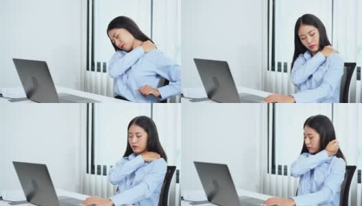 年轻的亚洲商务女性在办公室用笔记本电脑努力工作，因为颈部疼痛而做伸展运动，热身和锻炼的4k视频片段高清在线视频素材下载