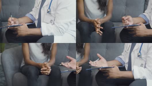 医生使用剪贴板与病人交谈高清在线视频素材下载