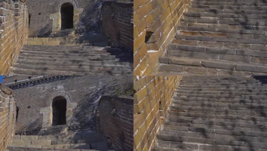 慢动作镜头拍摄的中国长城，上升的一边的山。摄像机移上楼梯，显示了瞭望塔的入口高清在线视频素材下载
