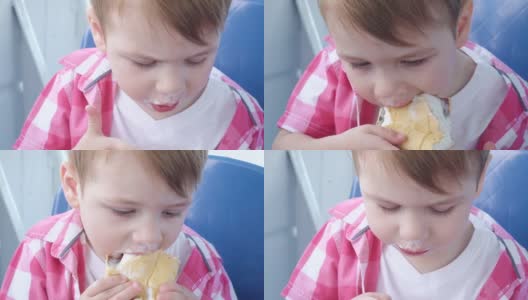一个男孩在船上吃冰淇淋高清在线视频素材下载