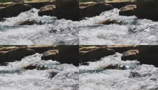 一股水流过岩石。高清在线视频素材下载