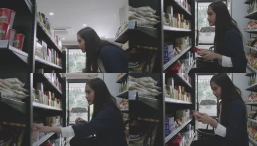 一名亚洲女商人身穿蓝色休闲装，正在一家杂货店购买商品和服务，然后在当地的一家泰国商店回家。高清在线视频素材下载