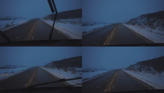 在怀俄明州暴风雪中的黄昏驾驶高清在线视频素材下载