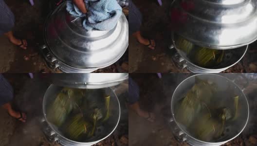 慢镜头:在锅里用香蕉叶包裹的泰国食物，热气腾腾高清在线视频素材下载