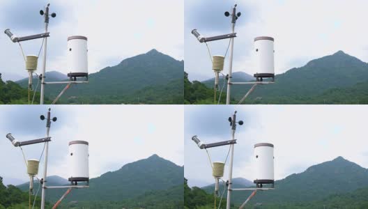 气象气象站天线与气象传感器，灰色多云天空和森林背景。高清在线视频素材下载