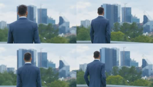 成功的商人欣赏摩天大楼的大城市景观。高清在线视频素材下载
