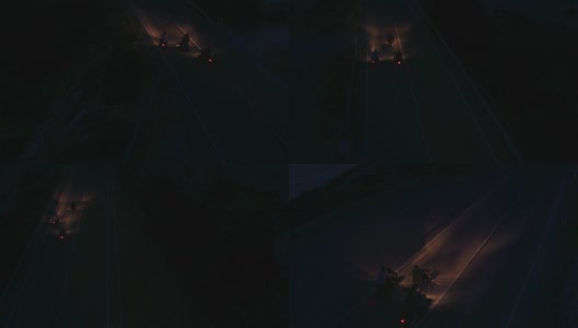 夜间摩托车手骑摩托车的鸟瞰图高清在线视频素材下载