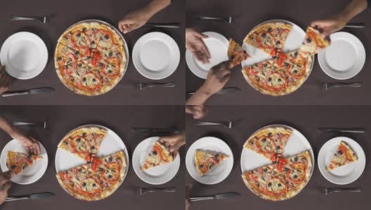 两只手拿起一片披萨，放进白盘子里。人们在吃意大利菜。饮食概念高清在线视频素材下载
