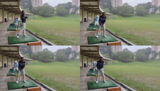 亚洲华人活跃的高级男子高尔夫球手在高尔夫练习场开球和挥杆他的潜水高尔夫球杆高清在线视频素材下载