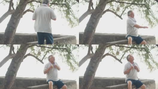 4K快乐的亚洲老人早上在海滩上锻炼。高清在线视频素材下载