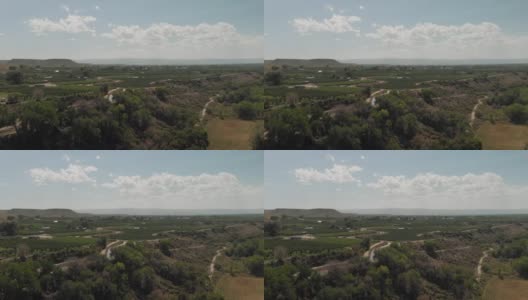 夏末无人机查看科罗拉多河流域农业绿地灌溉运河和BookCliff山脉4K视频系列高清在线视频素材下载